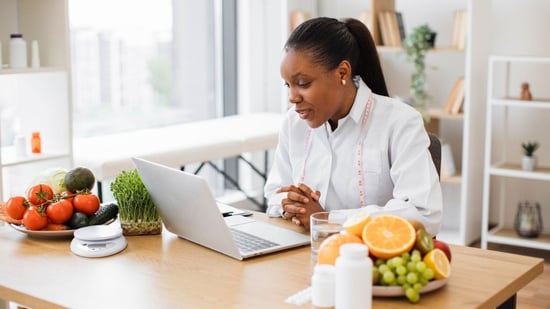 a fertility nutritionist consulting with a new patient during their first appointment