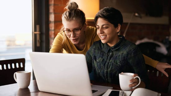 lesbian couple at laptop looking for sperm donor 